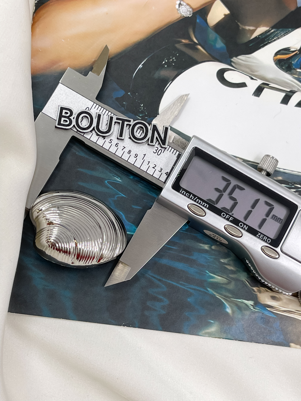 Пуговицы в форме ракушки серебристые