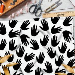 Ткань дюспо чёрные ладони на белом фоне