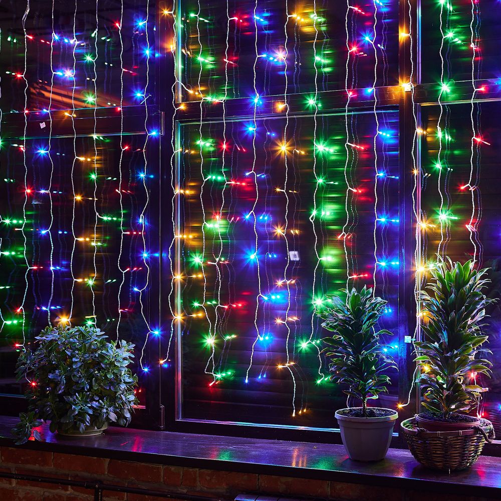 ULD-C3020-240-TTK MULTI IP44 Занавес светодиодный с эффектом мерцания. 3х2м. Соединяемый. 240 светодиодов. Разноцветный свет. Провод прозрачный. TM Uniel