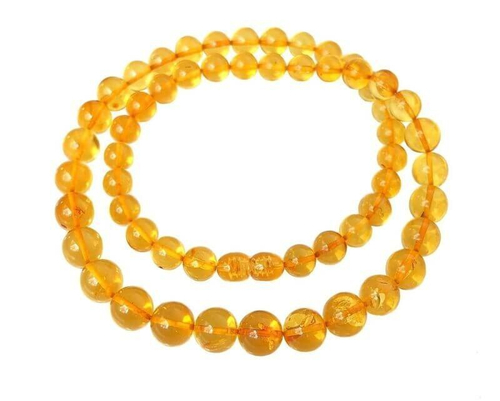 Элегантные бусы из прозрачных янтарных шаров