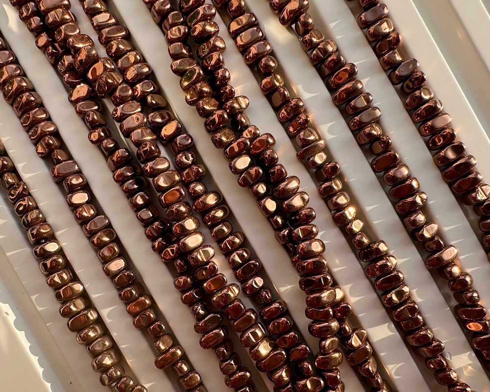 Нить гематитовых бусин, 7-9мм, галтовка