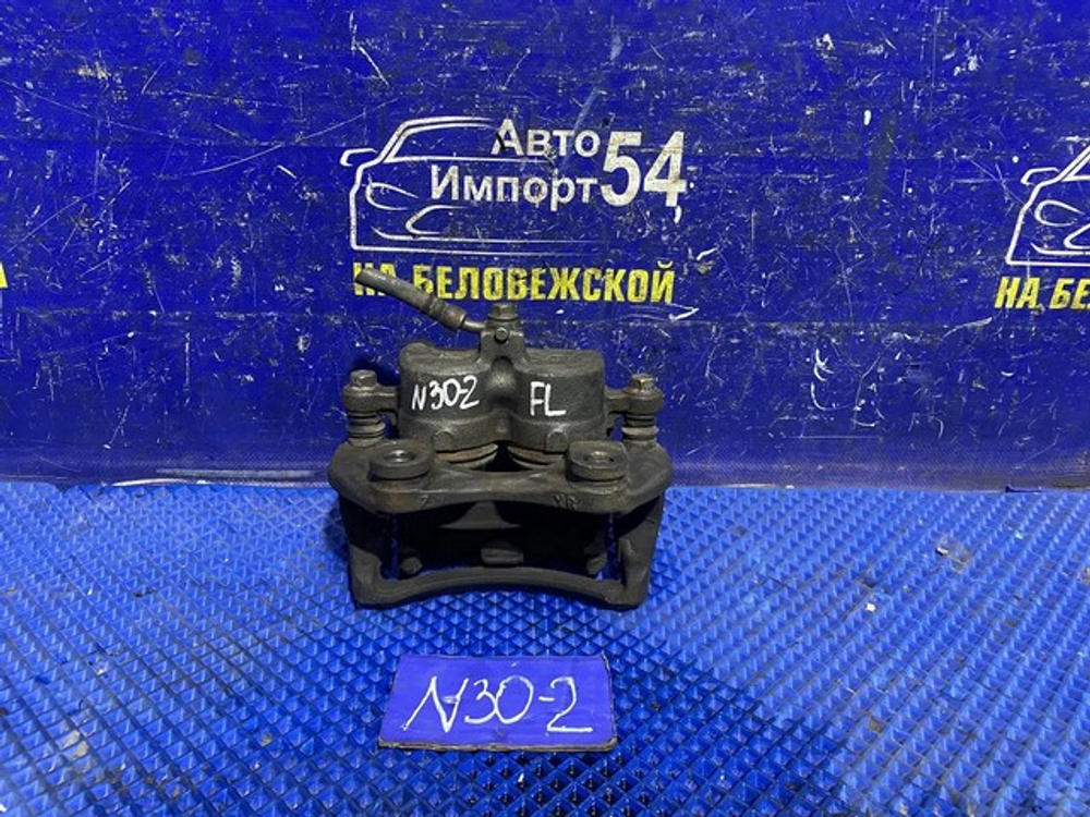 Суппорт тормозной передний левый NISSAN R'NESSA 1997