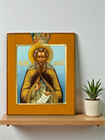 Эта православная икона изображает Преподобного Сергия Радонежского, величайшего русского святого и игумена земли Русской, с образом Святой Троицы в верхней части композиции.