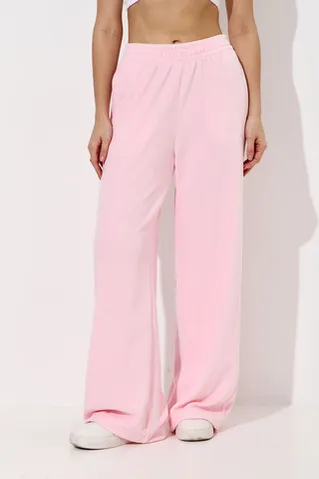 Широкие брюки на резинке из велюровой ткани розового цвета