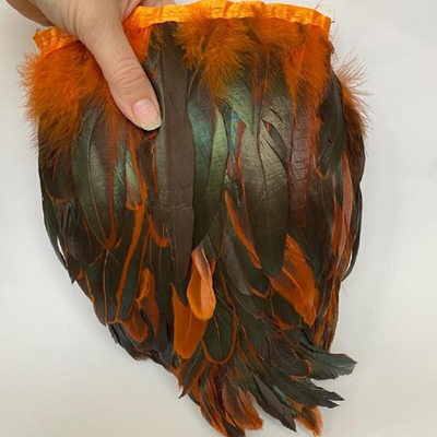 Перья двухцветного петуха на ленте оранжевые (перьевая тесьма) 12 - 18 см.