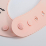 5385572 Нагрудник силиконовый, на кнопках, с карманом «Зайцы», цвет розовый