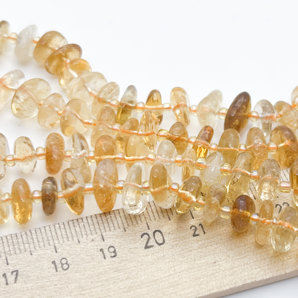 "Цитрин", галтовка, размер около 8-11,5*4,5-4,5 мм, цена за отрезок 19 см (1/2 нити)