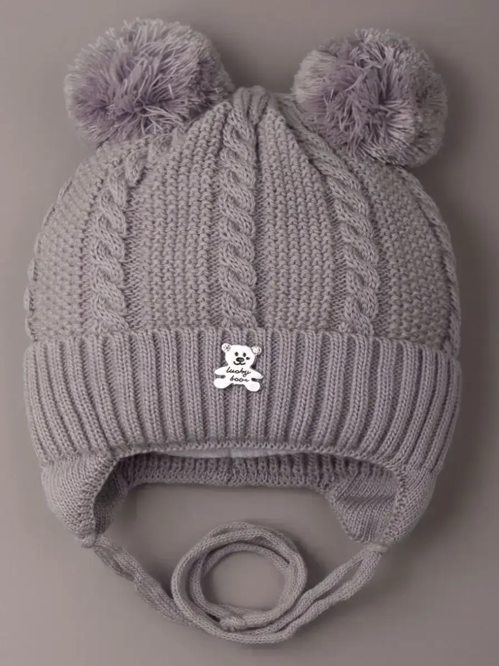 Шапка вязаная демисезонная на завязках