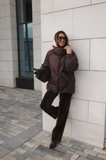 Пуховик средней длины с декором на карманах