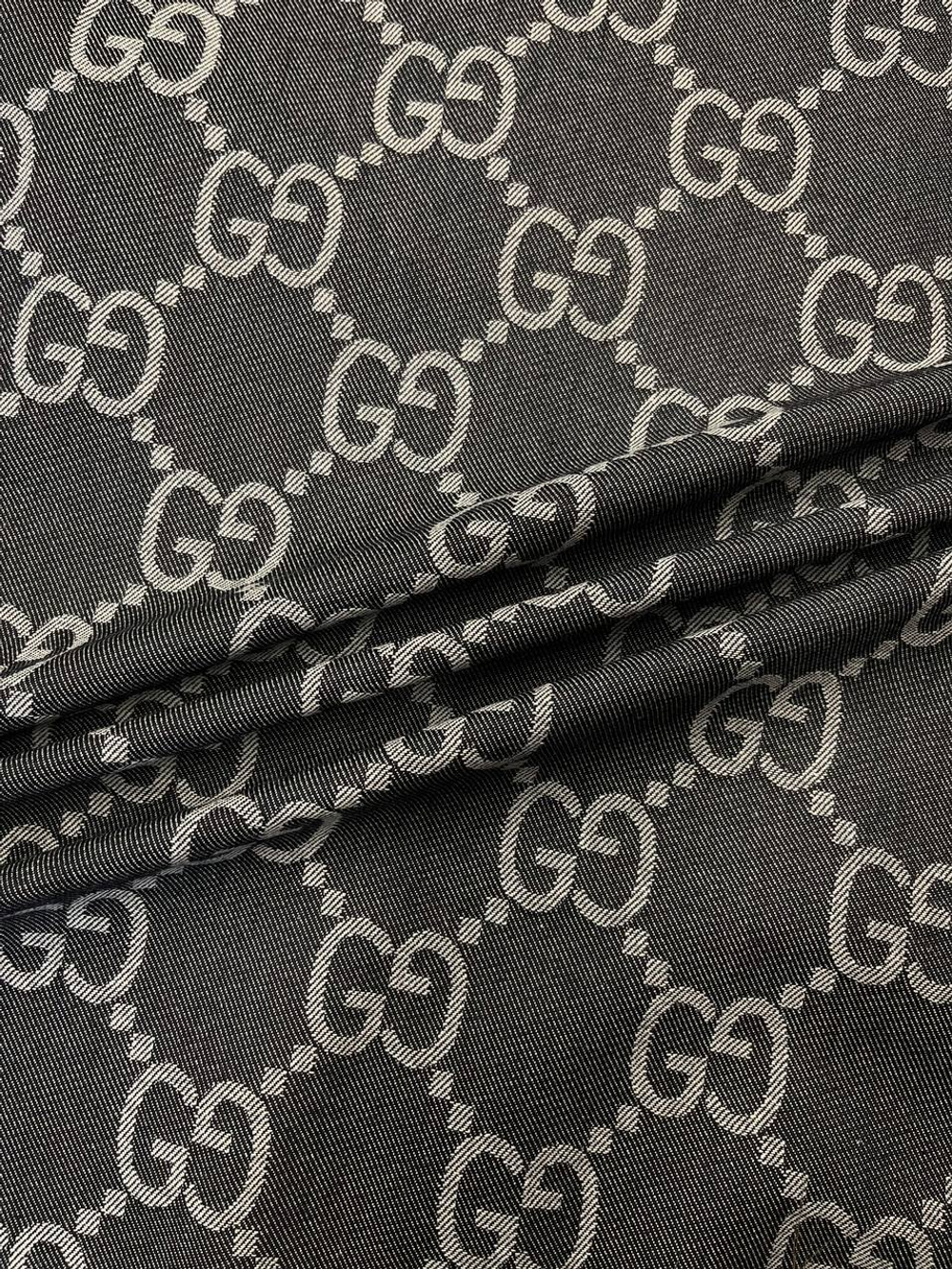 Джинса (деним) хлопковая Gucci синяя с дизайнерским лого