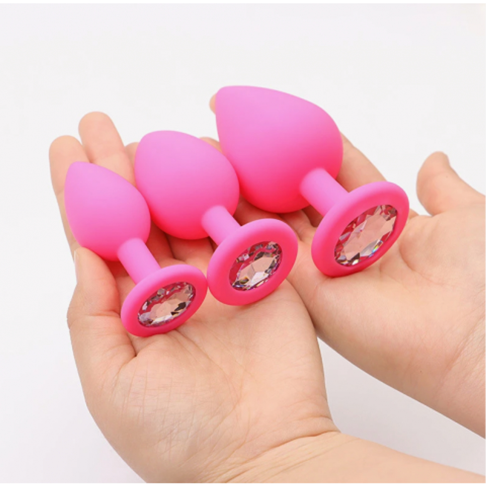 Анальная пробка из розового силикона с белым кристаллом (размер S)