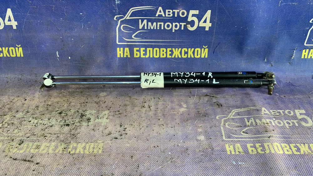 Амортизатор капота левый NISSAN CEDRIC 1999