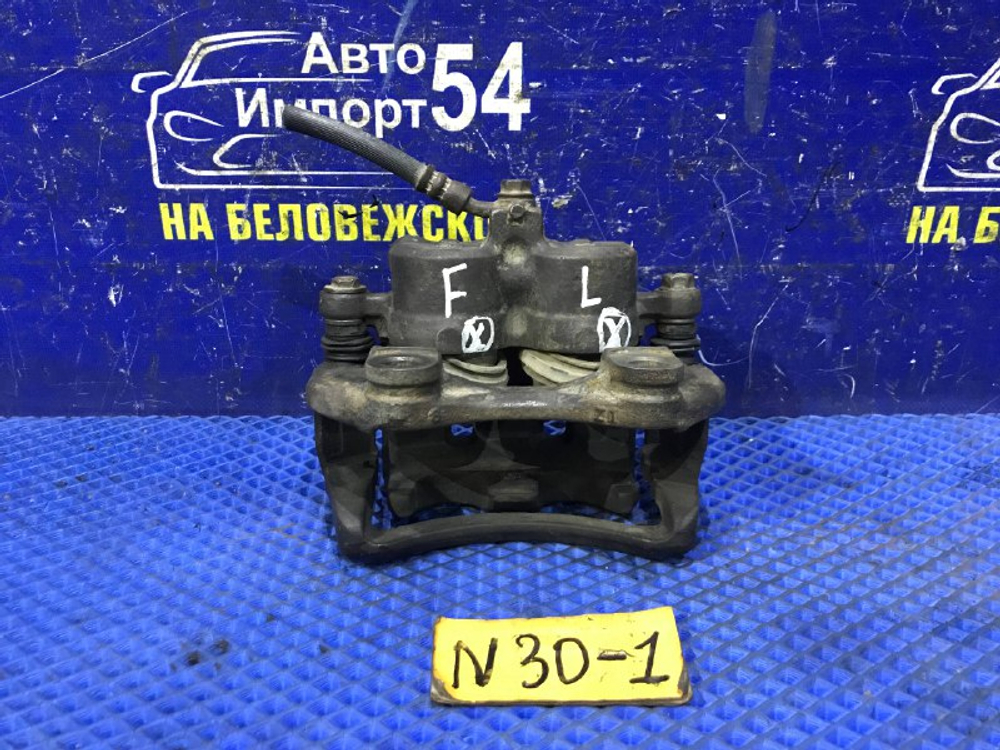 Суппорт тормозной передний левый NISSAN R’NESSA 1999