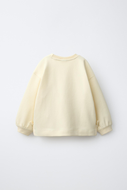 ZARA ТОЛСТОВКА С БАНТАМИ И СЕРДЦЕМ, ЦВЕТ СЛИВОЧНОГО МАСЛА