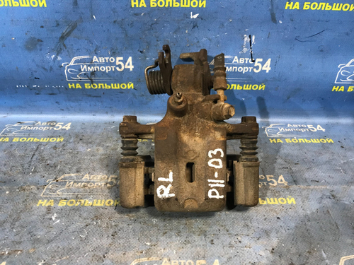 Суппорт тормозной задний левый NISSAN PRIMERA 1999