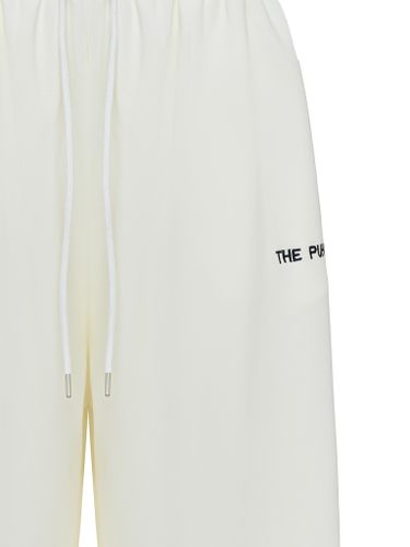 Широкие спортивные брюки молочного цвета