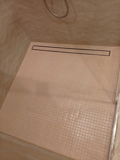 Изготовление и облицовка душевых поддонов