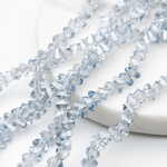 Бусина Треугольник, стекло, цвет голубой АВ, размер около 4,5*5,5 мм, цена за нить 28 см