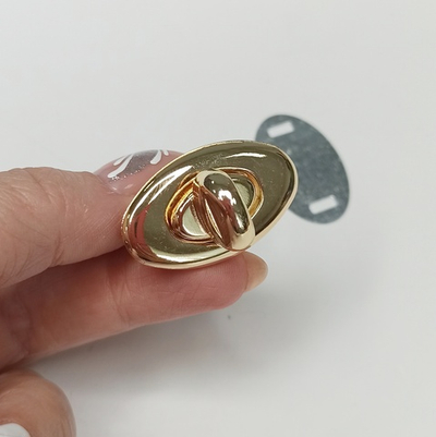 Замок вертушка на зажимах 34*20 Золото