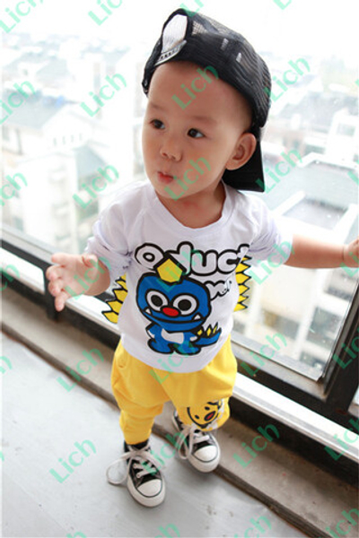 Комплект детский: лонгслив с принтом дракоши и брюки с принтами