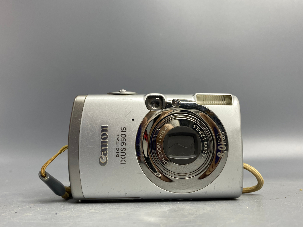 Canon Digital IXUS 950 IS, объектив шумит