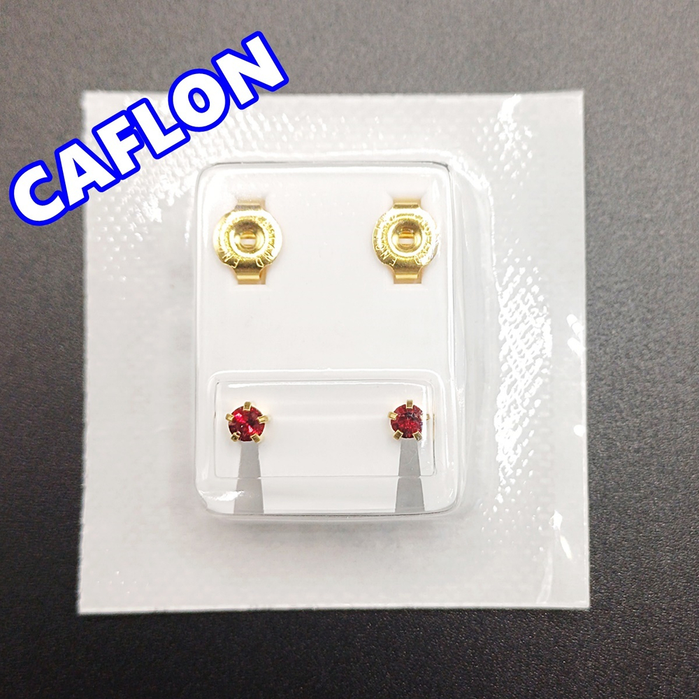 Серьги-гвоздики для прокола ушей под пистолет. CAFLON (Англия). Золотистые с темно-красными ( Январь)кристаллами, крапление