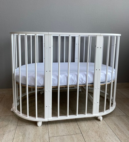 Кровать детская «Северянка» (3) 6 в 1 маятник универсальный/колесо (белый)