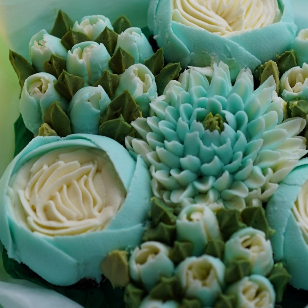 Букет из 7 цветочных капкейков в изумрудной палитре