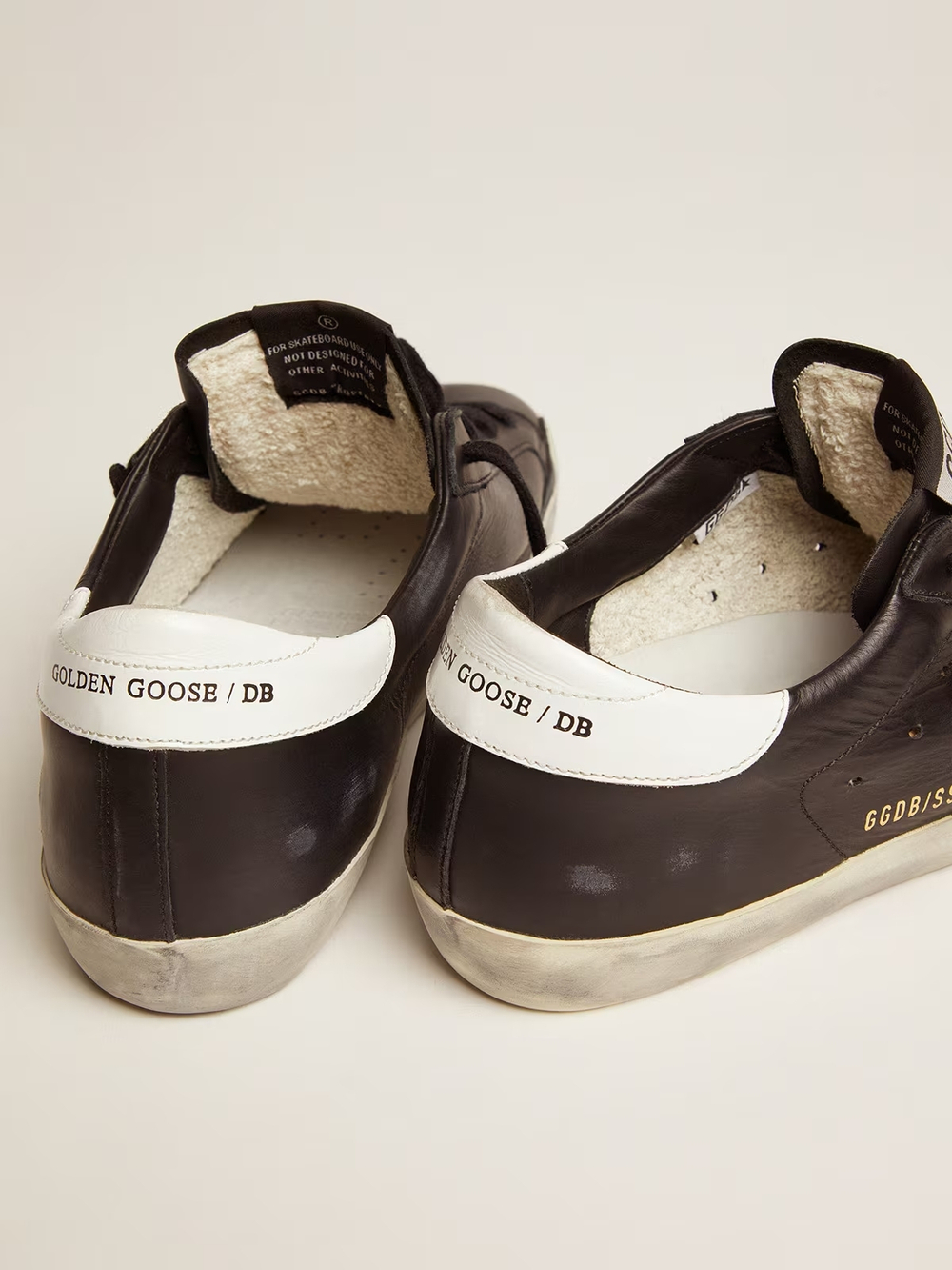 Super Star in black leather with white leather star and heel tab