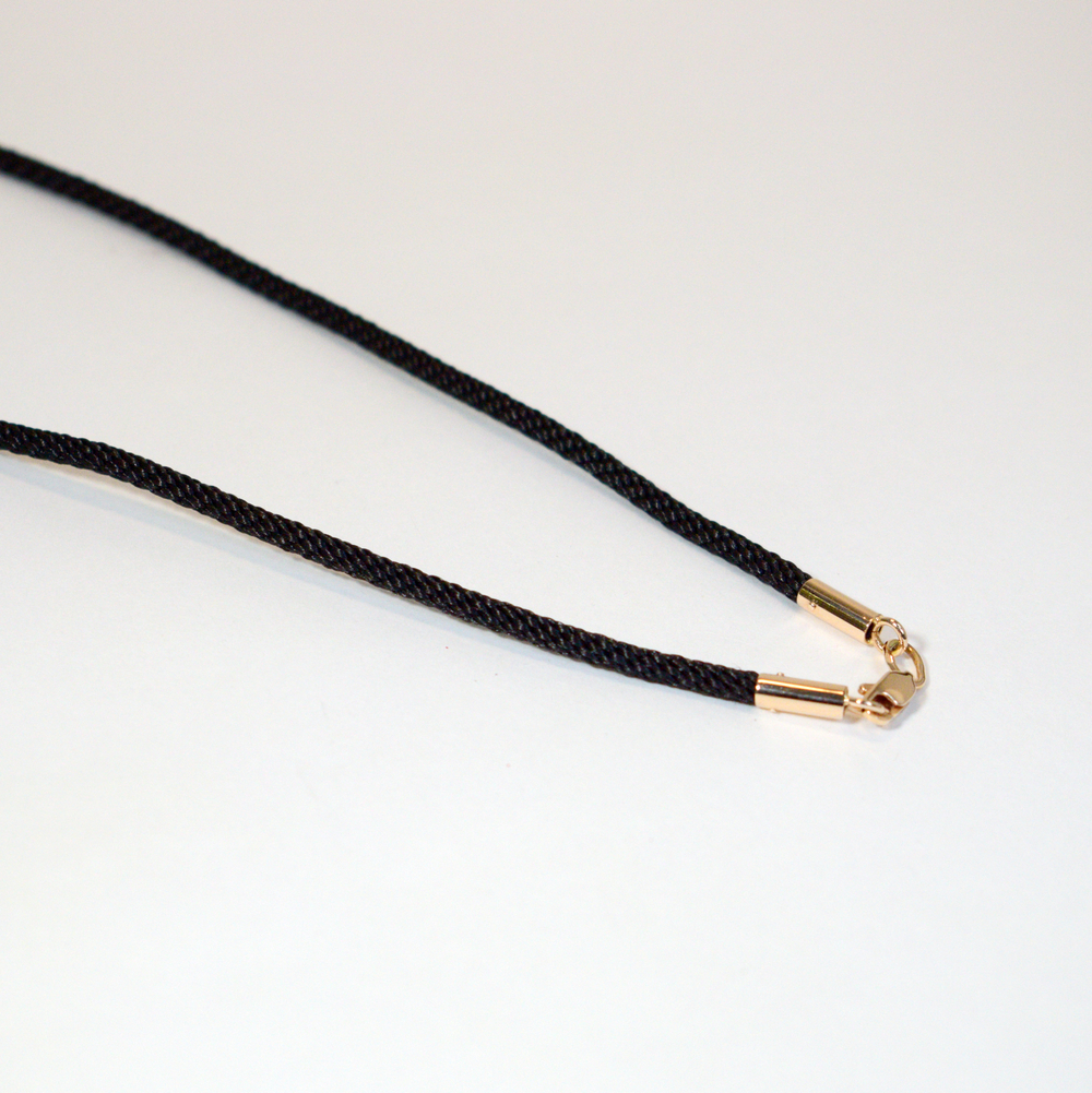 Гайтан с золотыми наконечниками.