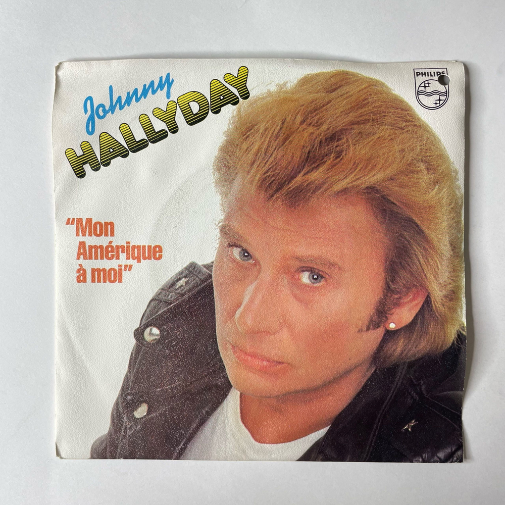 Винтажная виниловая пластинка 7 дюймов (маленькая пластинка) Johnny Hallyday Mon Amerique A Moi (Франция 1982)