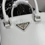 Женская маленькая сумка Prada с ручками и съемным плечевым ремнем