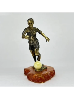 Бронзовая статуэтка на янтаре