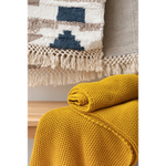 Плед из хлопка жемчужной вязки горчичного цвета из коллекции essential, 130х180 см