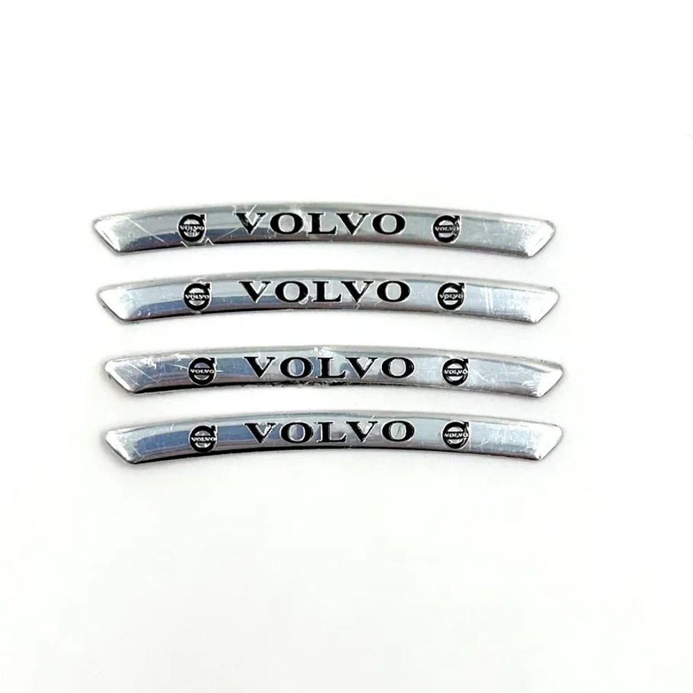 Наклейки Volvo черные объемные пластик (шильдик Вольво, 9х0,8см). Серебристые с черной надписью и лого Вольво - 4шт в комплекте
