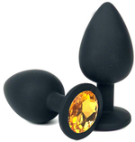 Черная силиконовая анальная пробка с оранжевым стразом - 10,5 см. (Цвет: оранжевый)