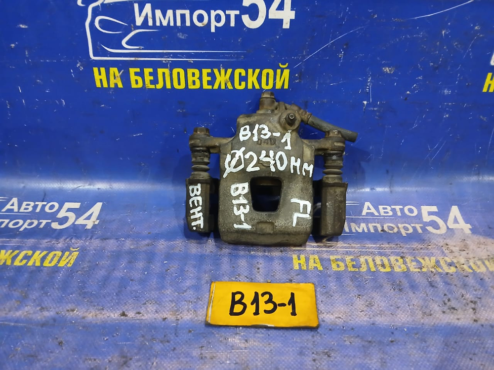 Суппорт тормозной передний левый NISSAN SUNNY 1990