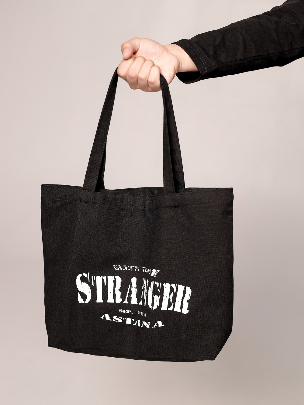Shopper with "Stranger" logo