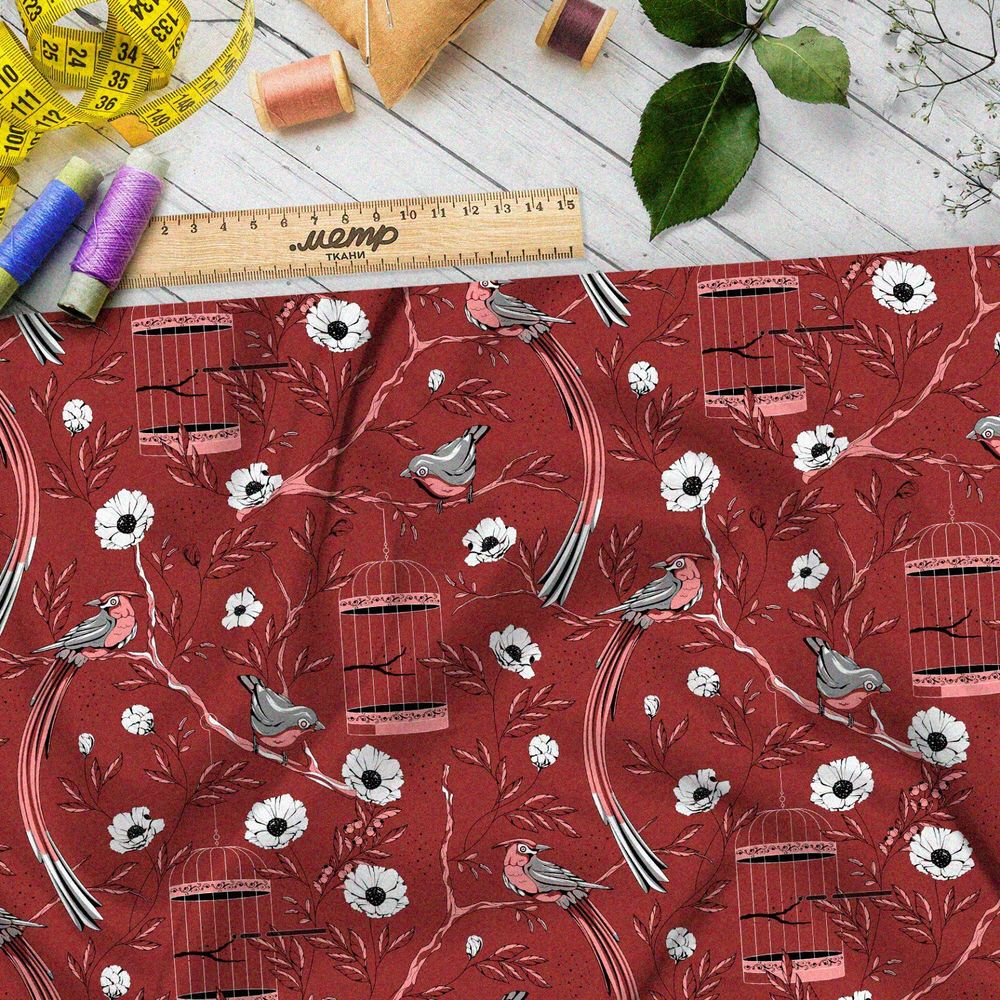 Ткань ниагара мелкие снегири, цветы и птичьи клетки на бордовом фоне