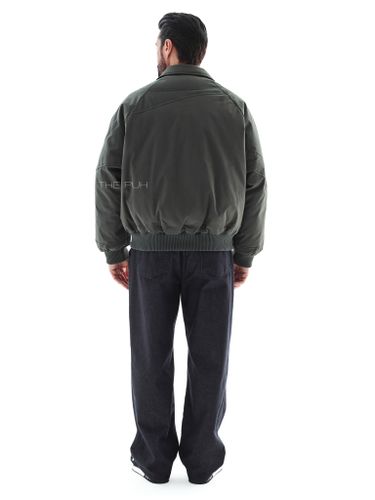 Утепленный зеленый бомбер с отложным воротником