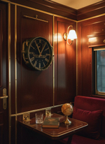 Настенные часы Oriental Express WOODandROOT в интерьере поезда, деревянные панели и тёплый винтажный свет