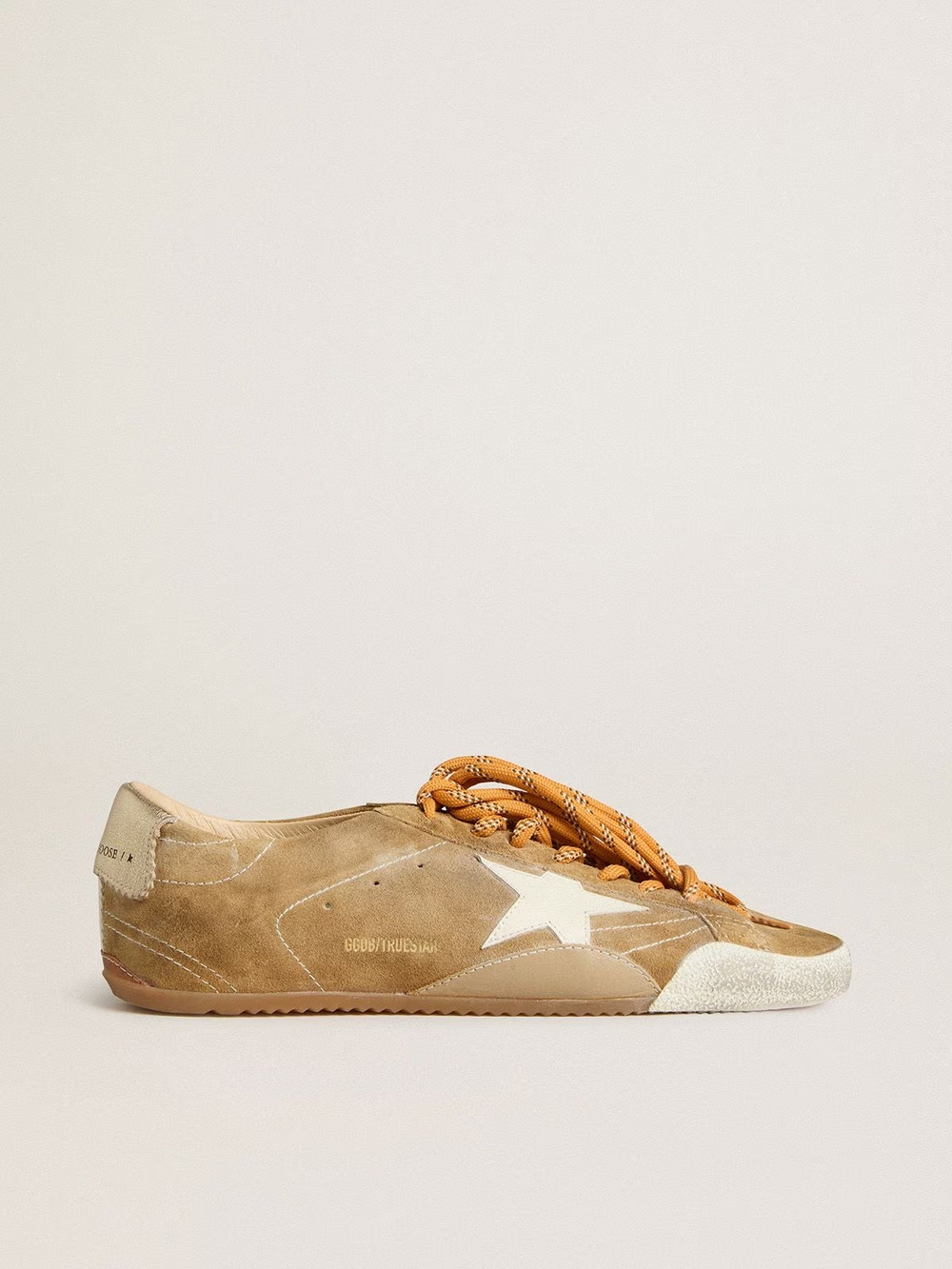 True Star in tobacco-colored suede with white star and platinum heel tab