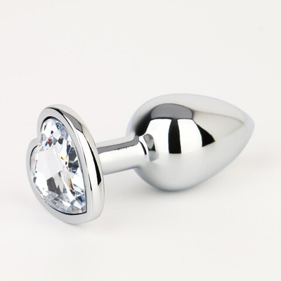 Серебристая анальная пробка с прозрачным кристаллом в форме сердца - 7 см. (Цвет: серебристый)