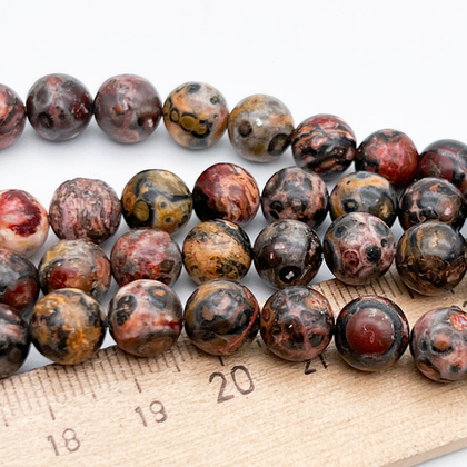 Риолит бусины, диаметр около 8-8,3 мм, цена за 22-23 шт (1/2 нити)