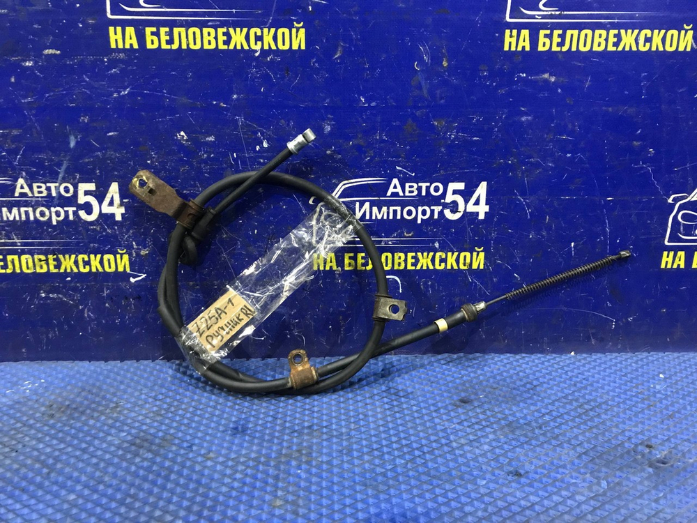 Трос ручника левый MITSUBISHI COLT 2003