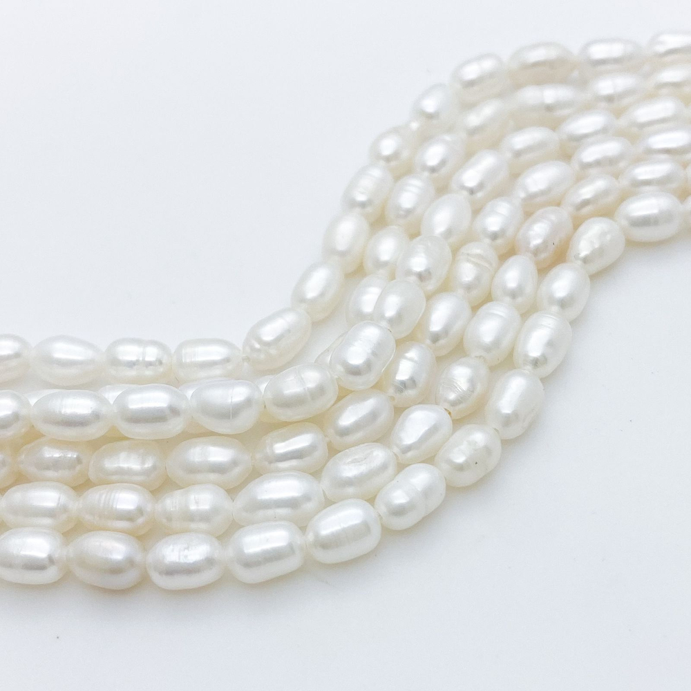 Жемчуг, размер около 6,5-7*4,5 мм, цена за 27-28 шт (1/2 нити)