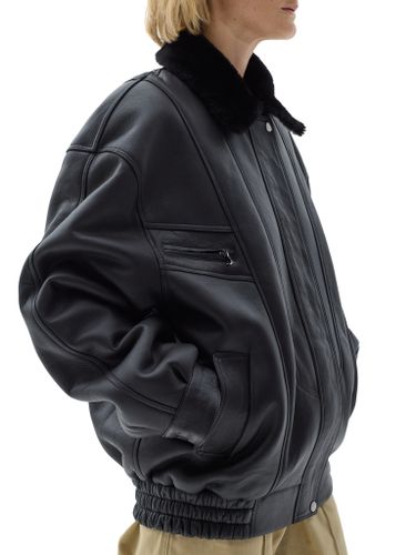 Черная кожаная оверсайз дубленка с отложным воротником