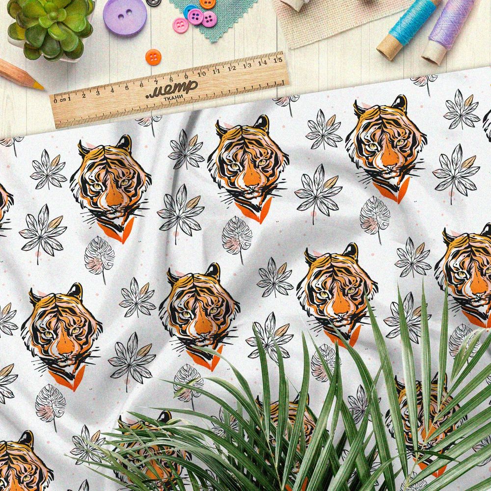 Ткань кулирная гладь головы тигров и эскизы листьев на белом фоне