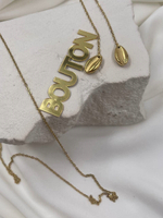 Колье золотистое с длинной цепью и подвесами на концах в виде ракушек