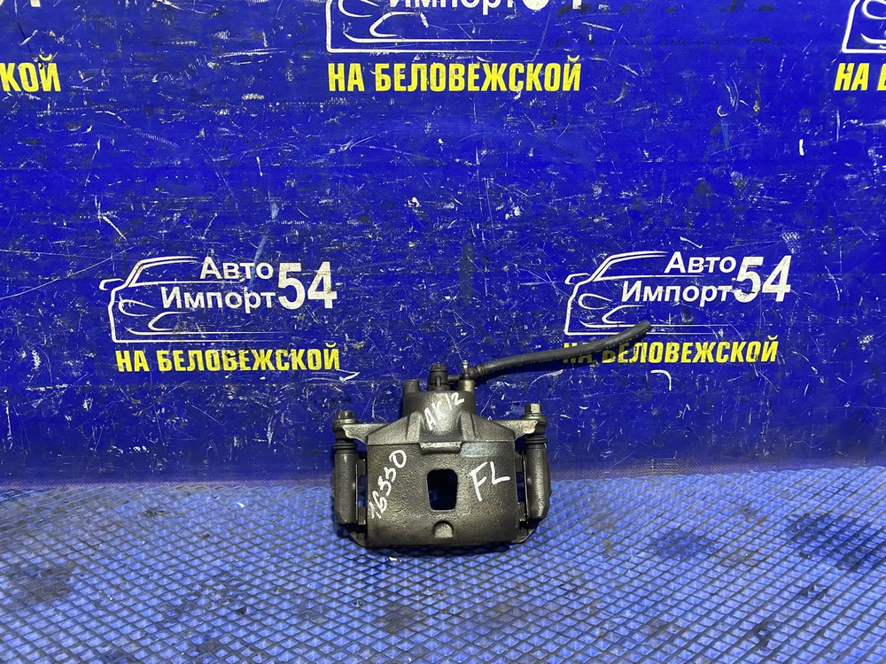 Суппорт тормозной передний левый NISSAN MARCH 2002-2010